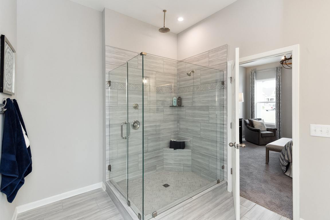 Primary bathroom with large walk-in shower / Primary bathroom with shower and garden tub