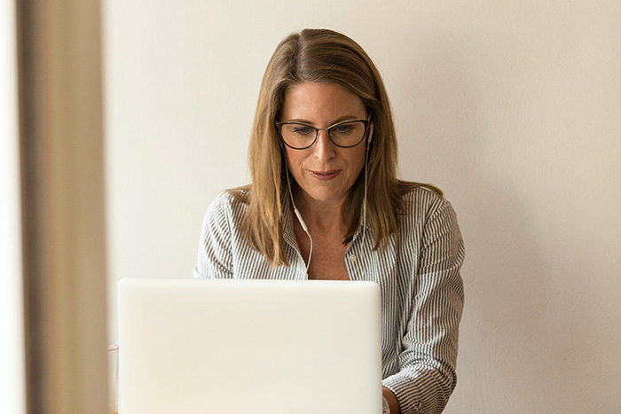 Man comparing mortgages at his desk