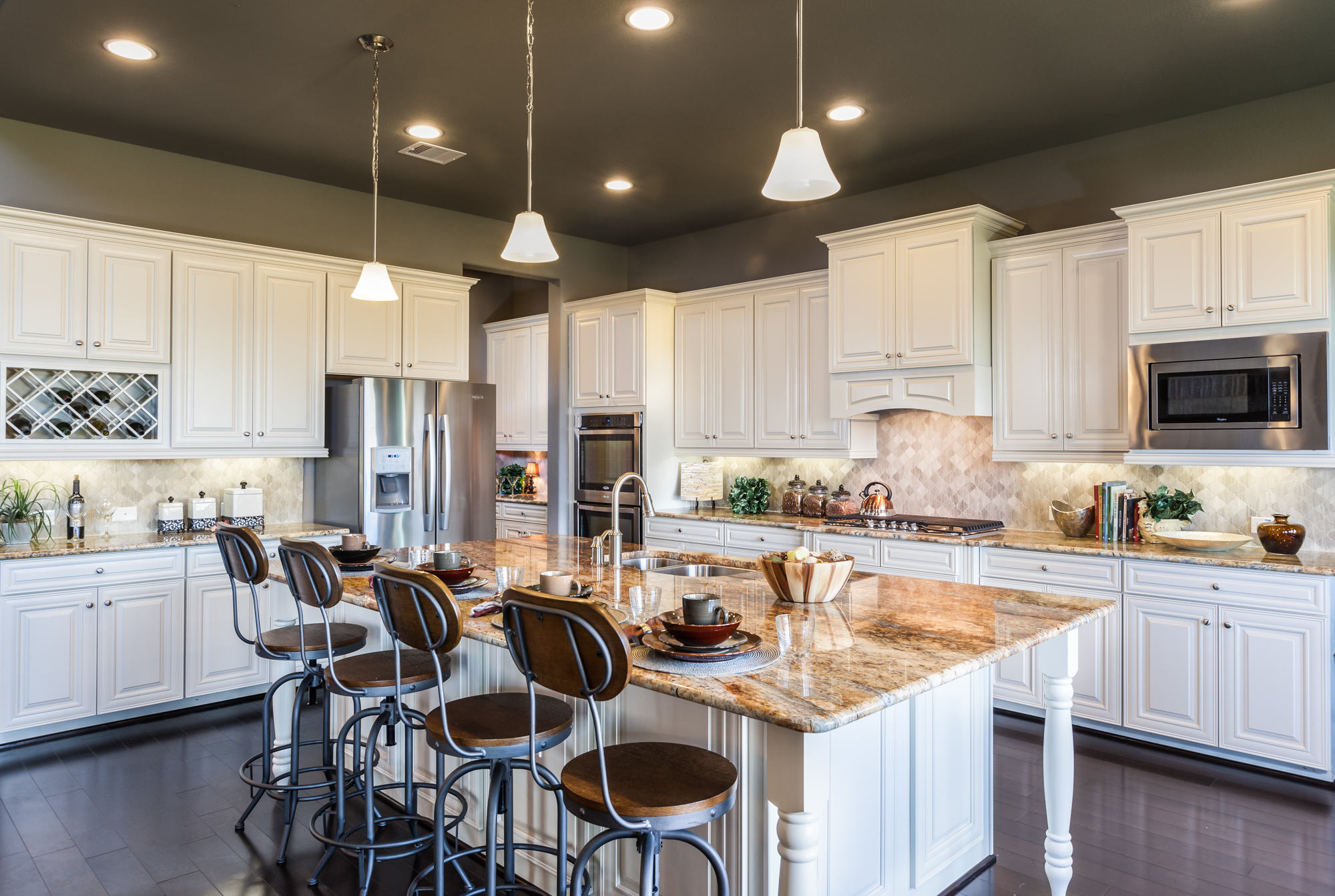 kitchen with white cabinets and large island