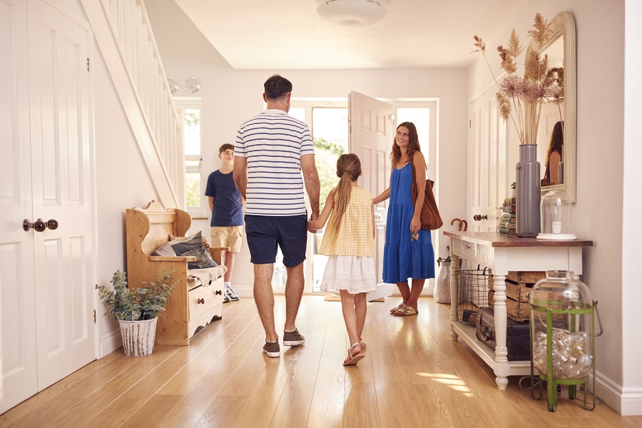 family of four walking out the front door after a self-guided tour