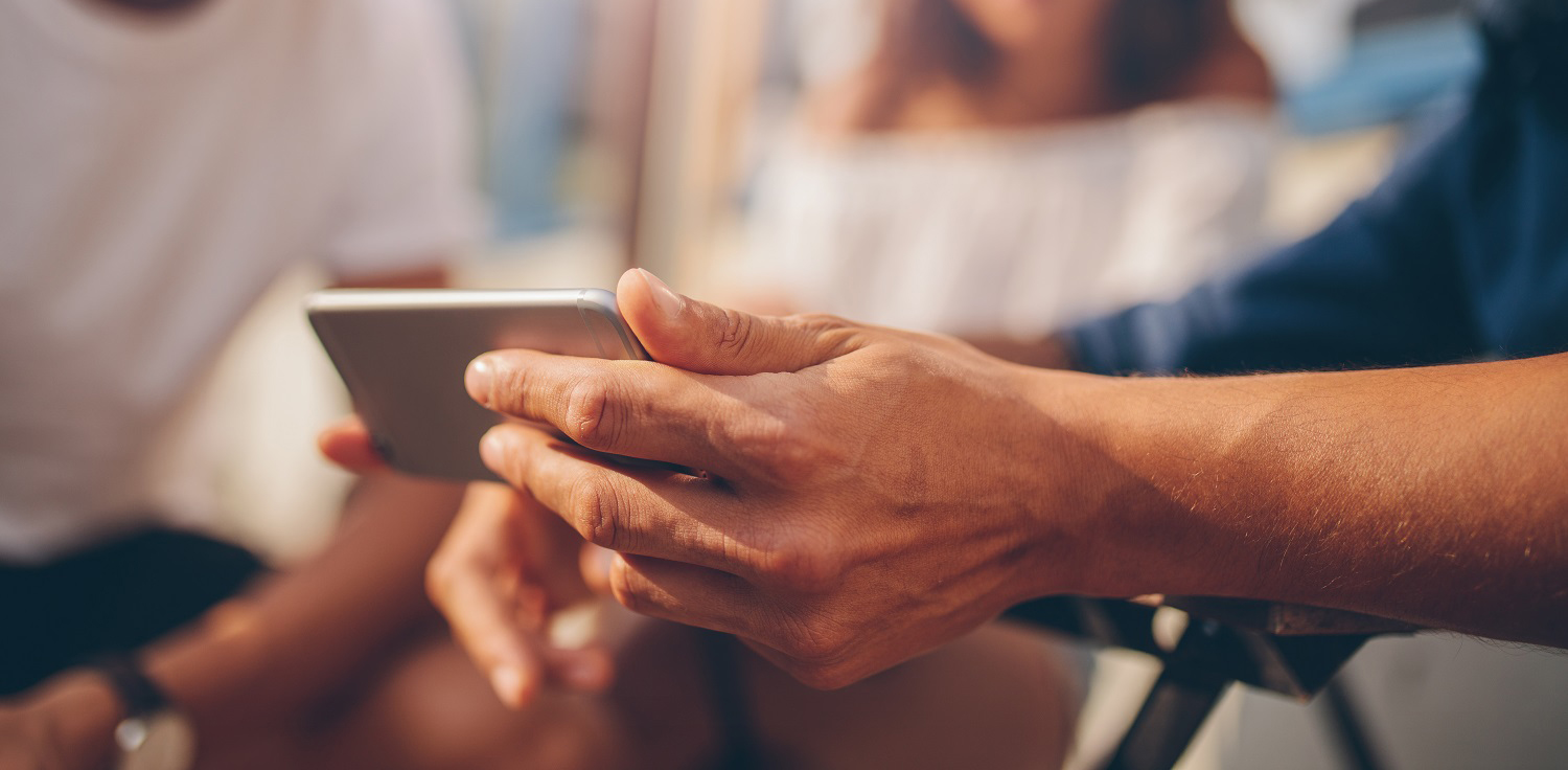 A person using their mobile device to view Beazer Homes